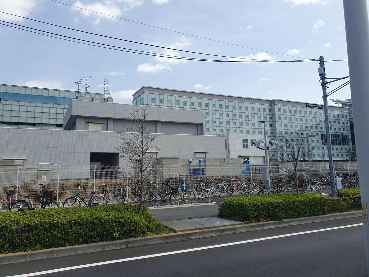The Royal Park Hotel Tokyo Haneda, exterior view with hotel signage from the airport shuttle bus